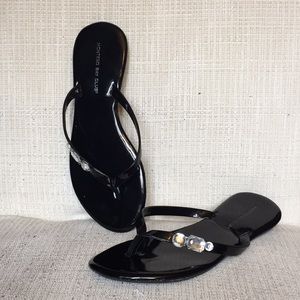 Black leather gem flip flops